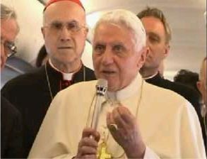 With Cardinal Bertone looking on, the Holy Father speaks of the Third Secret enroute to Fatima