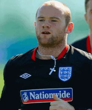 English soccer player Wayne Rooney wears a prominent cross and rosary beads