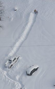 A person tries to dig out near Grove, Okla. on Wednesday, Feb. 9, 2011