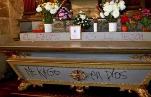 A side altar vandalized with blasphemous graffiti in Santiago de Chile's cathedral, July 25, 2013
