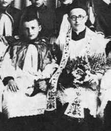 Karol, at age 13, as an altar boy with the parish priest of Wadowice