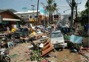 A street is littered with damaged vehicles and debris after the area was hit by tidal waves at Patong beach in Phuket, Thailand, Sunday December 26, 2004. The most powerful earthquake in 40 years triggered massive tidal waves that slammed to coastlines across Asia on Sunday, killing more than 14,800 people in Sri Lanka, Indonesia, India, Malaysia and Thailand. 