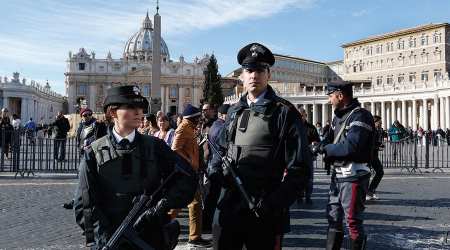 Members of the Italian military police force stand guard following Pope Francis Nov. 22 Angelus.