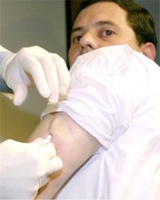 Carlos Altamirano ismplanted with the VeriChip, a microchip that is used to confirm everything from health history to identity in this July 17, 2003 file photo , in Mexico City. Security has reached the subcutaneous level for Mexico's Attorney General Rafael Macedo de la Concha and at least 160 people in his office- they have been implanted with microchips that get them access to secure areas of their headquarters.