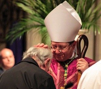 Mgr Keith Newton annoints a candidate's head with chrism