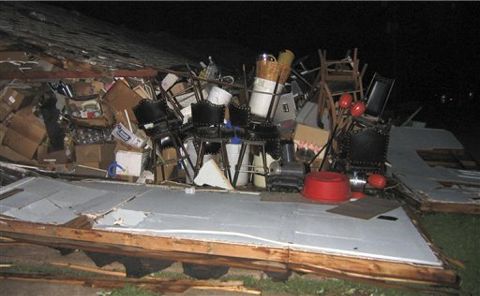 A pile of furniture lies outside a damaged building in Greensburg, Kan. early Saturday morning, May 5, 2007 after a tornado ripped through this southwest Kansas community and killing at least seven people. The tornado struck Friday night, leaving a broad swath of destruction in the Kiowa County town about 110 miles west of Wichita.