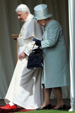 Britain's Queen Elizabeth II and Pope Benedict XVI walk through the gardens at the Royal Palace of Holyroodhouse in Edinburgh, Scotland, Sept. 16. 