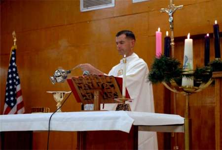 Capt. Joel Panzer fills the chapel at Iraq's Camp Liberty with the smell of incense during a Christmas Mass in December 2010.