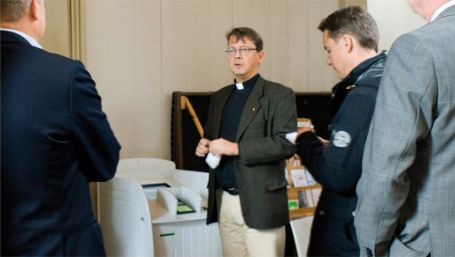 Vicar Johan Tyrberg in the Carl Gustaf Church in Karlshamn, southern Sweden, on Sept 7, 2011, stands next to a credit card machine enabling worshippers to donate money to the church collection without carrying money in their pockets. 