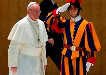 Nelson Krueger, Pope John Paul II's Methodist Pilot, dries the Pope's cape in the cockpit air vent