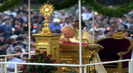 St. John Paul II prays before the Blessed Sacrament