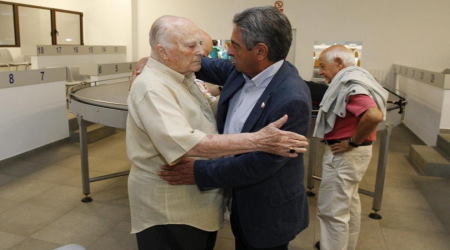 Archbishop Pablo Puente Buces (left), former papal nuncio to the United Kingdom, embraces local politician Miguel Angel Revilla after declaring his intention to petition the pope for the ordination of women. 