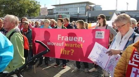 Members of German 'Catholic' feminists' group Maria 2.0 carrying a sign that reads: "Women, what are you waiting for?", Oct. 2019. 
