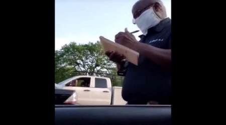 Mississippi policeman issues ticket to Chris Owen for attending drive-in church service in Greenfield, Mississippi, April 8, 2020.