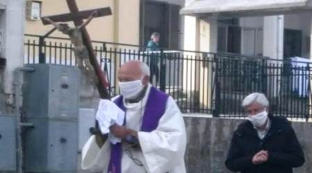A priest was fined and sent into quarantine for carrying a miraculous crucifix through the streets of his town. 