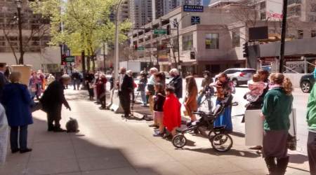 Catholics pray outside Holy Name Cathedral. Chicago, Illinois.
