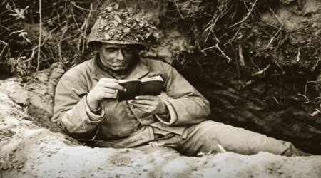 Soldier reads Bible