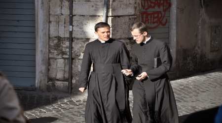 priests wearing cassocs