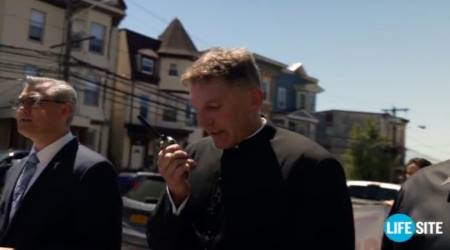 Michael Hichborn of the Lepanto Institute and Father James Altman praying the rosary outside Cardinal Joseph Tobin's cathedral