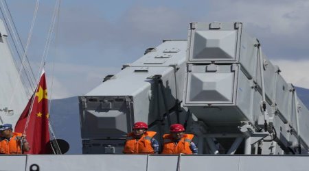 Chinese People's Liberation Army (PLA) Navy sailors stand on the deck of the Qinzhou guided-missile frigate in Hong Kong, Wednesday, Sept. 8, 2021