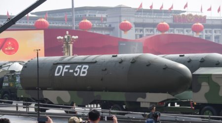 Military vehicles carrying DF-5B intercontinental ballistic missiles participate in a military parade at Tiananmen Square in Beijing on Oct. 1, 2019.