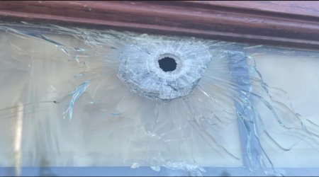 A gunman shot bullet holes into a Denver-area Catholic church on Saturday and again Monday