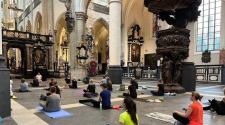 yoga practioners in historic church of St. James in Antwerp