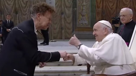 Francis greets Andres Serrano at the Vatican, June 23, 2023.