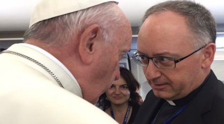Pope Francis with Fr. Spadaro on board the papal plane