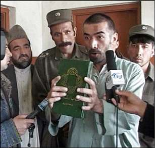 Muslim clerics are adamant that Abdul Rahman, above, holding a Bible, be executed for converting to Christianity.